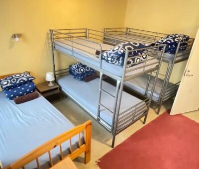 Two bunk beds and one single bed